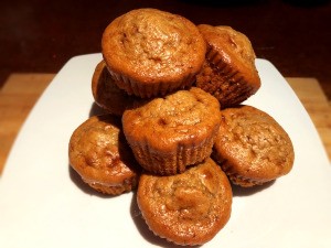 Flourless PB Chocolate Chunk Protein Muffins piled on board