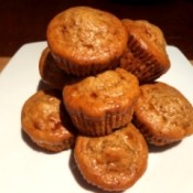 Flourless PB Chocolate Chunk Protein Muffins piled on board