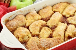 Baked Apple Dumplings in a red baking dish.