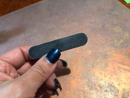 Trimming and Upkeep of Acrylic Nails - smooth jagged edges with a file