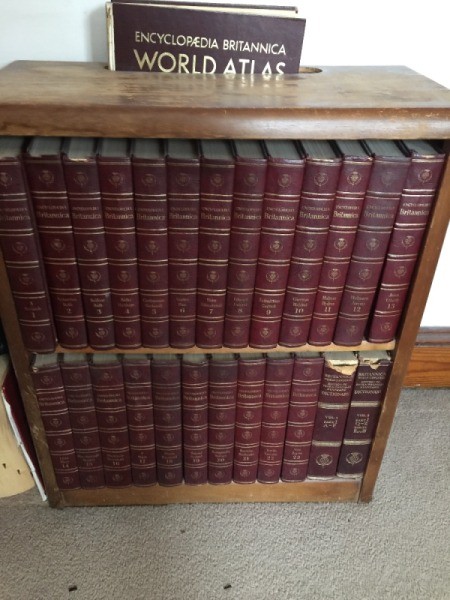 Value of 1768 Britannica Encyclopedia Set - volumes on bookcase shelves