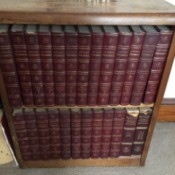 Value of 1768 Britannica Encyclopedia Set - volumes on bookcase shelves