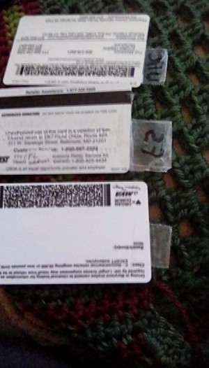 ID cards with tape attached to one end.