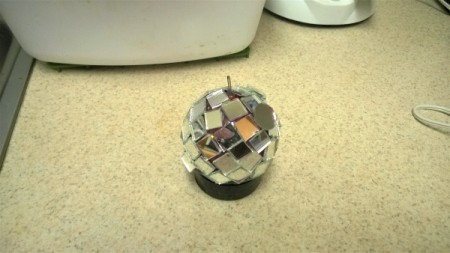 Mirror Ball for Cats - sit the ball inside the lid and finish gluing on the mirror pieces