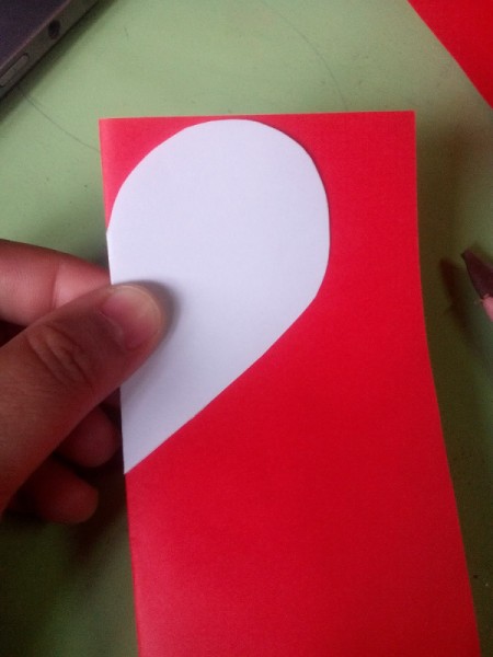 Pop Heart Decoration - using the white heart as a template cut out 12 half hearts from the red paper