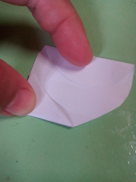 Pop Heart Decoration - fold the tip up and over and do the same with the curved top portion