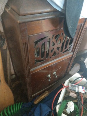 A wooden record player cabinet.