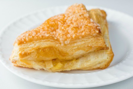 Apple turnover on a white plate.