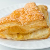 Apple turnover on a white plate.