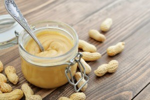 Amish church Spread in a glass jar surrounded by peanuts.