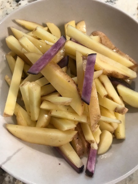 cut potatoes in bowl