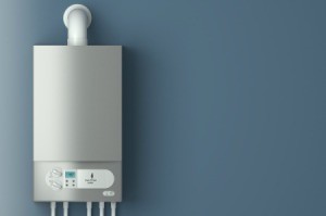 Electric broiler on a grey wall.