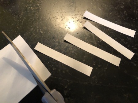 Felt Fortune Cookies - cut strips of white paper shorten than the diameter of the circle