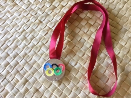 Edible Olympic Medals - silver medal on red ribbon