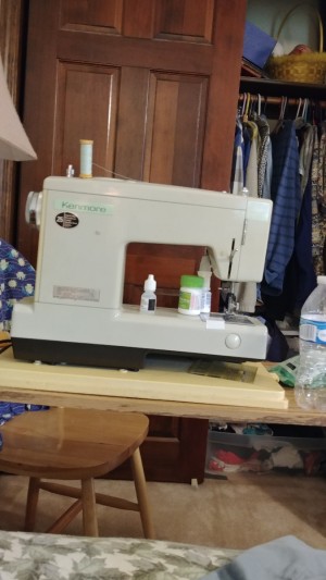 Removing a Kenmore Sewing Machine from Its Cabinet - sewing machine on a work table