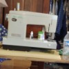 Removing a Kenmore Sewing Machine from Its Cabinet - sewing machine on a work table