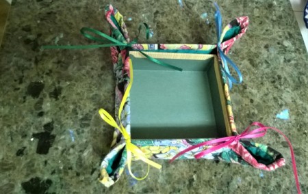 Make a Jewelry Box from a Pot Holder - corners of the pot holder pinched together and tied with a bow