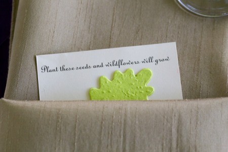 Flower seeds wedding favor in a beige napkin.