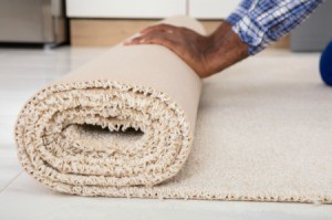 A roll of carpet with a raw edge.