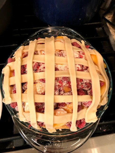 strips of dough on pie