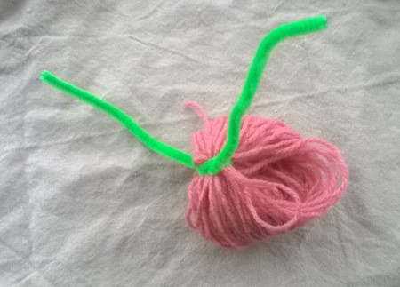 Making a Woolly Monster - tie a pipe cleaner over the knot
