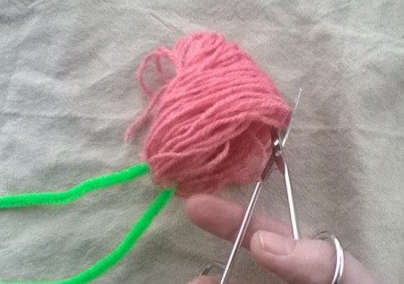 Making a Woolly Monster - cut through all of the threads opposite the pipe cleaner