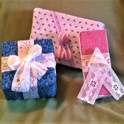 Fabric Covered Display Boxes - display packages wrapped in fabric and tied with lace bows