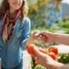 Woman Buying Organic
Tomatoes