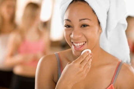 Woman Applying Facial Toner