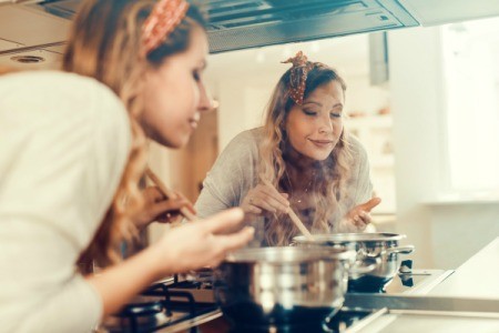 Woman Cooking in Her Kitchen