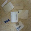 Several credit cards cut into pieces.