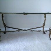 Value of Castcraft Tables - glass topped cast metal table