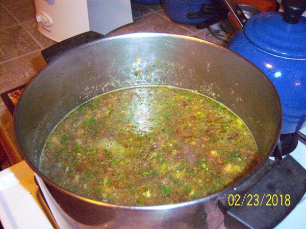 A pot of soup made with juiced vegetables.