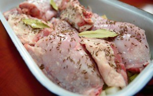 Raw rabbit ready for cooking in roasting pan