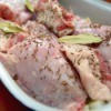Raw rabbit ready for cooking in roasting pan