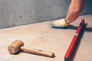 Tile installer with level and mallet