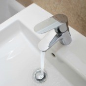 Faucet running water into Bathroom Sink