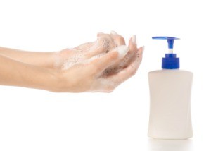 Woman washing her hands with bubble bath soap