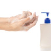 Woman washing her hands with bubble bath soap