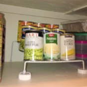 Using two pill bottle lids to support a wire shelf.