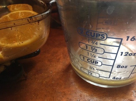 tipped juice from baking dish in measuring cup