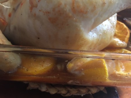 Spicy Orange sauce in pan around chicken