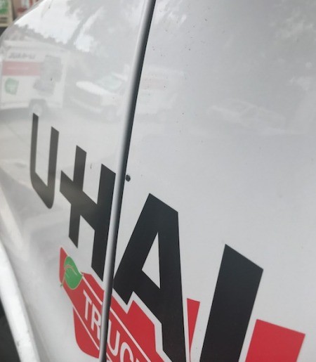 The side of a U-Haul rental van.