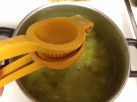 squeezing lemon into pot