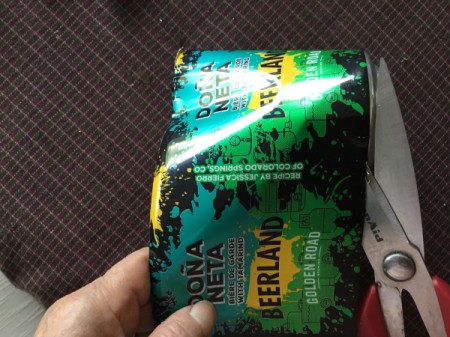 Aluminum Can Pinwheel - puncture the bottom of the can and cut it off