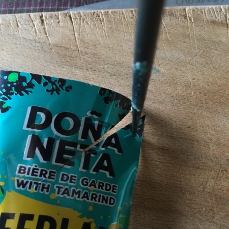 Aluminum Can Pinwheel - punch a hole in the upper left corner of each section and punch a hole in the center of the square