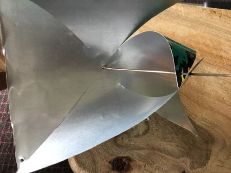 Aluminum Can Pinwheel - bring down each corner with the hole and thread the wire through