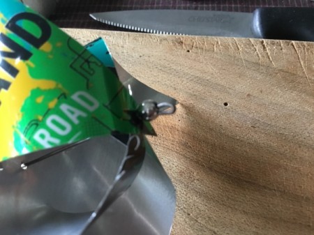 Aluminum Can Pinwheel - use pliers to bend and secure the wire over the bead