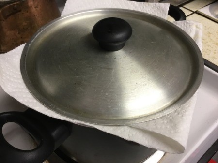 pan with paper towel and lid