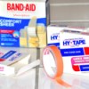 Packages of Band-Aids and Hy-Tape for covering healing wounds.